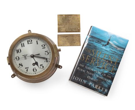 A German U Boat clock, with a brass case and a silvered dial with Arabic numerals number 15932. 20cm wide 9.5cm deep. This cl