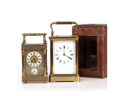 A late 19th century French brass carriage clock 9.5cm wide 14cm high together with a small French carriage time piece (2)