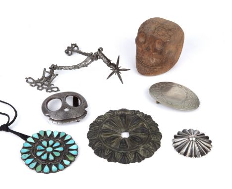 Miscellaneous items to include a steel buckle in the form of a skull a carved wooded memento mori an antique steel rowel spur