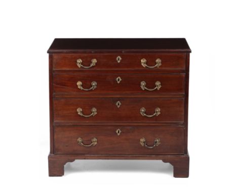 A George III mahogany chest of four long drawers with brass rococo handles, raised on bracket feet, 83cm wide x 46cm deep x 7