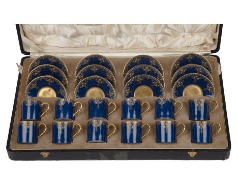 A late 19th / early 20th century Royal Worcester twelve piece coffee service with a blue ground and gilded decoration, all in