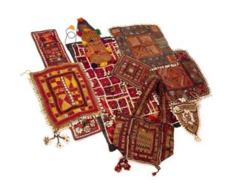 A group of Northern Indian Banjara embroidered panels with applied cowrie shells the largest square 42cm x 43cm