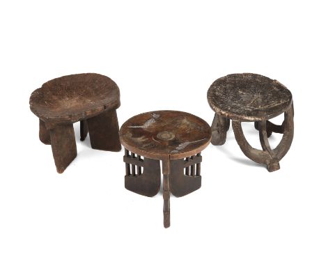 Three antique African carved wood tribal stools to include a Kamba stool with bead decoration all approximately 33cm diameter