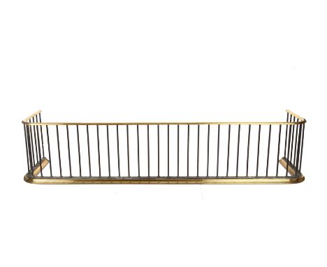 A Georgian brass and steel fire fender 140cm wide 30cm deep 30cm high