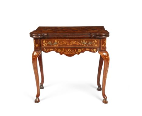 An early 19th century Dutch marquetry card table with a fold over top opening to reveal playing card inlaid corners and a blu