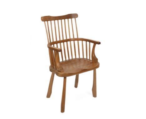 A modern comb back Windsor chair 60cm wide 40cm deep 102cm high