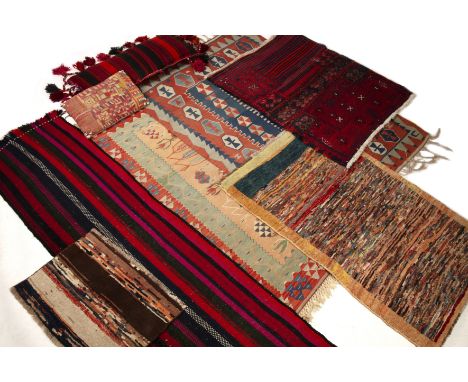 Textiles to include two late 20th century kelim rugs the largest 120cm x 170cm a kelim cushion 40cm x 90cm and an Indian cush