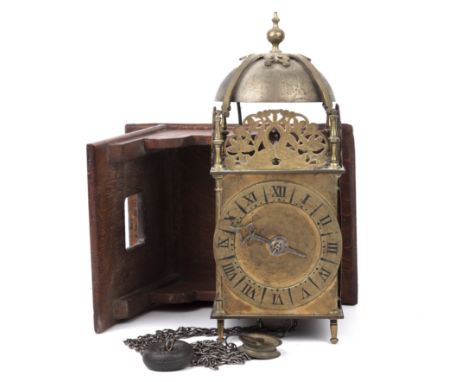 17th century style lantern clock the brass dial with roman numerals 14cm wide 36cm high