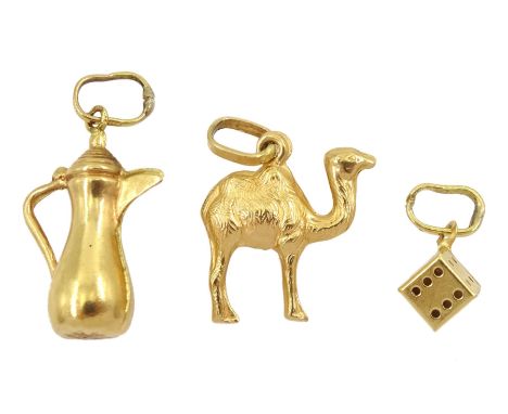 Three 18ct gold pendant/charms including jug camel and diceCondition Report:Approx 2.57gm