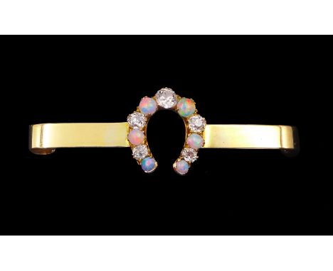Victorian opal and diamond horseshoe brooch, five graduating old cut diamonds, with six graduating opal set between, stamped 