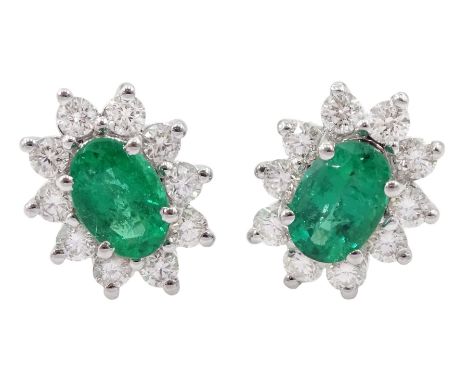 Pair of 18ct white gold oval emerald round brilliant cut diamond stud earrings, stamped 18K, total diamond weight approx 0.55