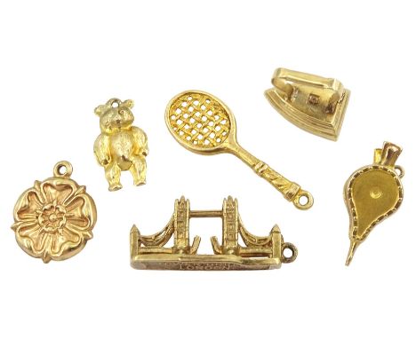 Six 9ct gold pendant/charms including Tower Bridge London, tennis racket, bear, Yorkshire rose and ironCondition Report:Appro