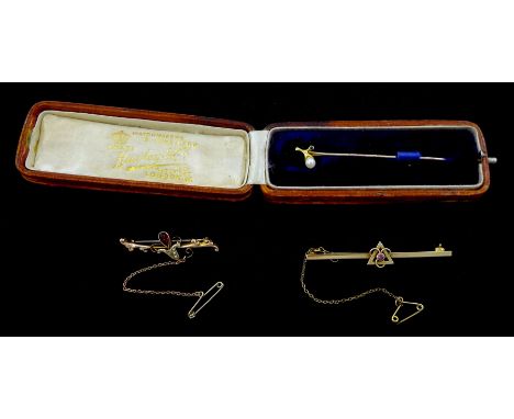 Early 20th century gold garnet and seed pear brooch, one other gold brooch and a gold pearl and sapphire stick pinCondition R