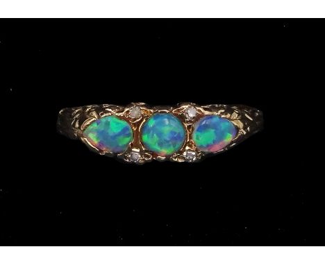 9ct gold three stone opal ring, with diamond accents set between, hallmarkedCondition Report:Approx 1.7gm, size N, max depth 