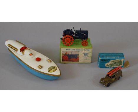 A mixed group of toys including an unboxed Sutcliffe Bluebird clockwork boat missing key but with operational mechanism, a bo