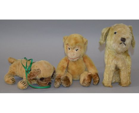 A group of three soft toys, a Chiltern Monkey, a Boxer Dog and a seated Terrier. (3)