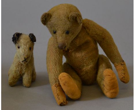 A small vintage early 20th Century Teddy Bear with long arms, approximately 21cm tall, thought possibly to be by J.K.Farnell 