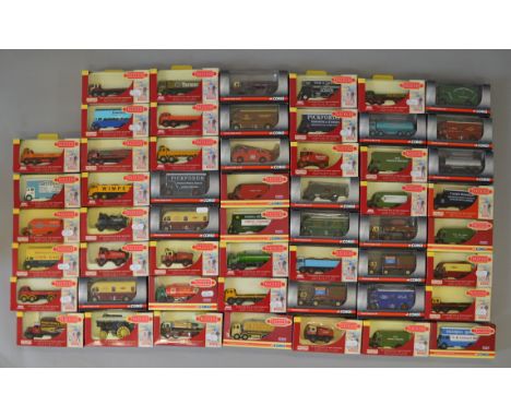 Fifty four boxed Corgi and Lledo branded 'Trackside' diecast van and truck models in 1:76 scale. Models appear G+ in generall