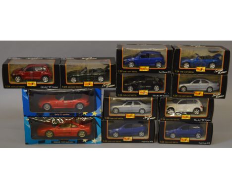 Ten boxed Maisto 1:24 scale diecast model cars together with two boxed UT Models 1:18 scale cars, a BMW Z3 and a Ferrari F355