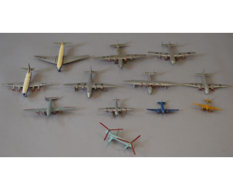 Twelve unboxed Dinky Toys diecast model aircraft including a 62m Light Transport aircraft in blue (G-ATMH) and a 60g Light Ra