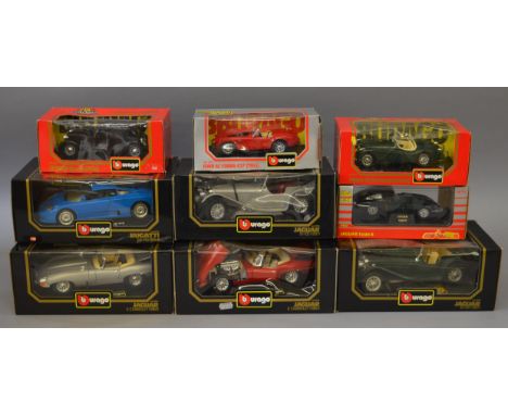 Five boxed diecast model cars by Bburago in 1:18 scale including two 1961 Jaguar E type Cabriolets in red and silver together