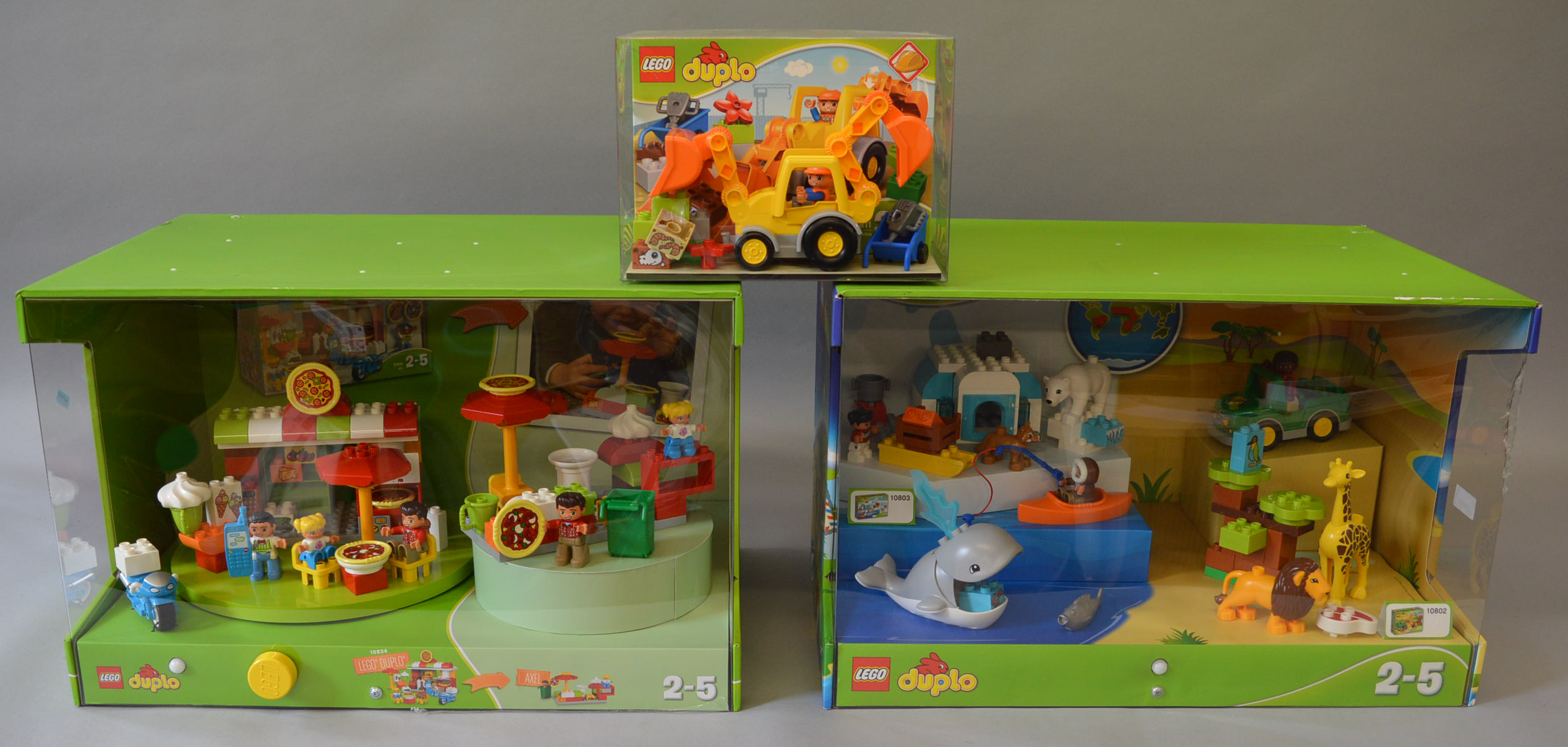 Two Lego 'duplo' Shop Display Units, one featuring sets 10802 and 10803