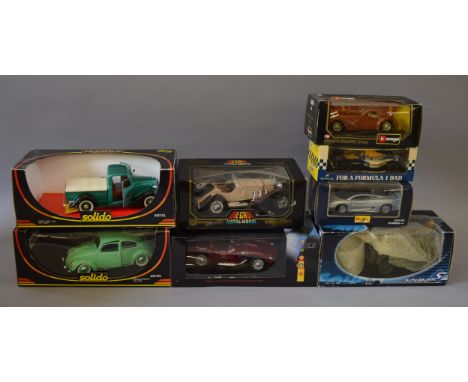 Eight boxed diecast models in 1:18 and 1:24 scale by Solido, Bburago and others, including a 1942 SAS Jeep. Condition of mode