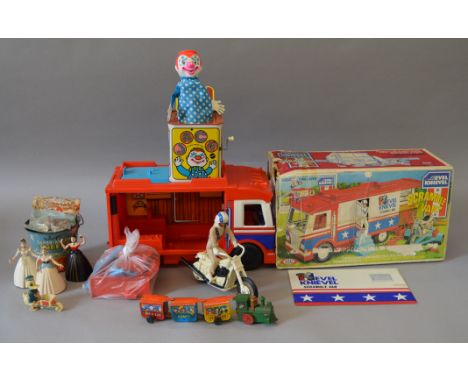 A mixed lot of toys including a boxed Ideal Evel Knievel van, three unboxed Wells Brimtoy clockwork dancing ladies, a Sharp's