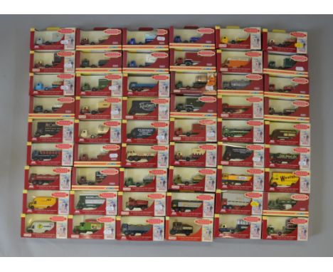 Fifty four boxed Corgi and Lledo branded 'Trackside' diecast van and truck models in 1:76 scale. Models appear G+ in generall