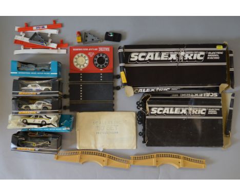 Five boxed Scalextric slot cars including C053 Datsun 260Z, a  Ford Escort Mk1 and C130 Triumph TR7, all untested in P boxes,