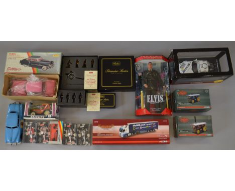 A mixed lot of boxed diecast vehicle and figure models by Corgi, Britains and others together with a boxed tinplate 'Cadillac