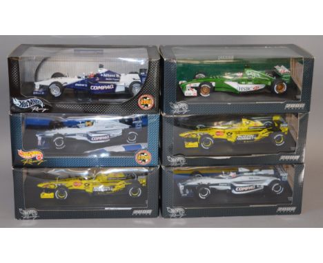 Six boxed Hot Wheels 1:18 scale diecast model Racing Cars. Overall models appear G+ in F to G boxes. (6)