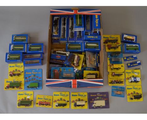 Sixty eight boxed and carded Base Toys diecast car, van, bus  and truck models in 1:76 scale, together with some accessory pa