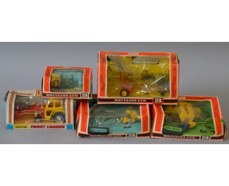 A boxed Britains 9572 Massey Ferguson front loader Tractor together with four boxed Farm Implements, 9540, 9542, 9548 and 956
