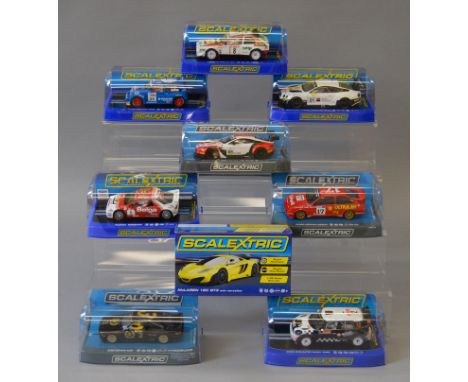 Nine boxed Scalextric cars, including Bentley, MG, Mini, BMW and Ford models, All appear VG in VG boxes. (9)