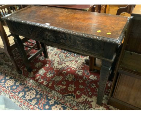 An antique oak carved hall console table with single drawer W 107 cm 