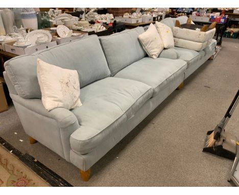 Two large Ercol upholstered sofas together with an Ercol storage stool in different fabric 
