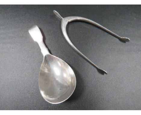 A hallmarked silver caddy spoon together with a pair of hallmarked silver wish bone sugar tongs (2) 