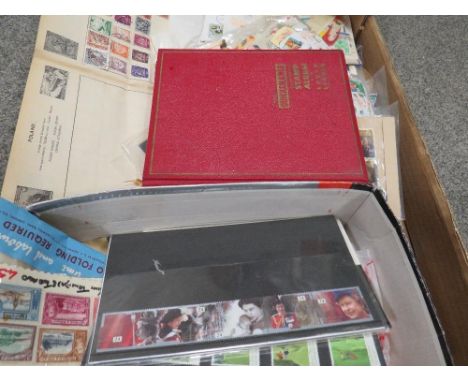 A box of stamp albums and stamps 