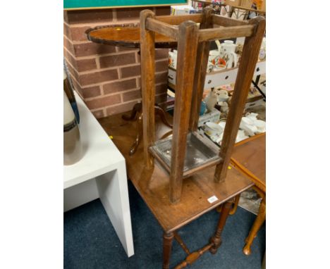 An Edwardian occasional table together with a walnut pedestal table and an oak stick stand 