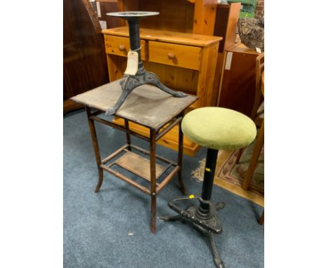 A vintage bamboo table together with a lightweight cast stool and stool base 
