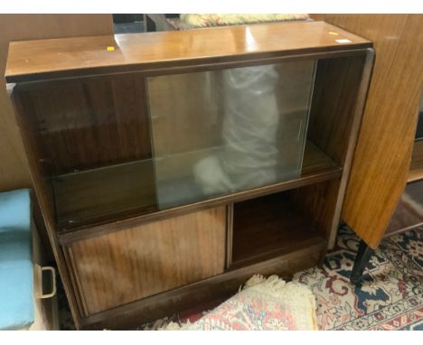 A vintage teak, sliding door bookcase 