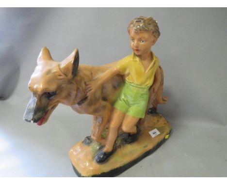 A vintage chalk figure of a boy and his dog A/F 