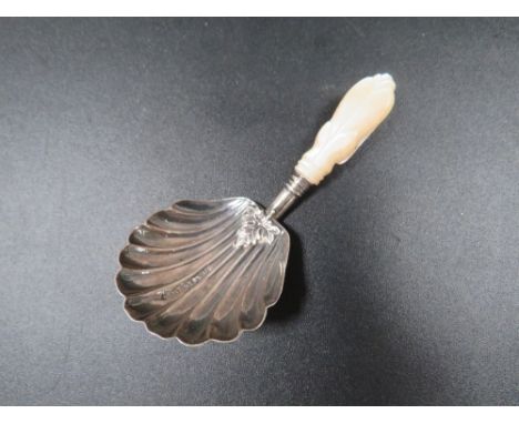 An antique silver caddy spoon 