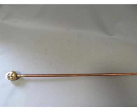 A brass topped copper walking stick 