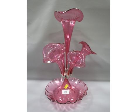 An early 20th century cranberry glass epergne 