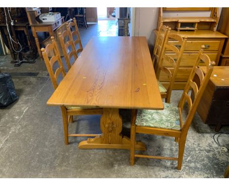 A pine Ercol refectory table and six chairs 
