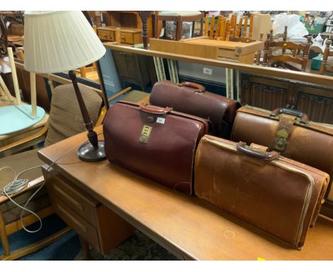 A retro cowhide case to go with another similar and a mahogany table lamp with three modern baskets 