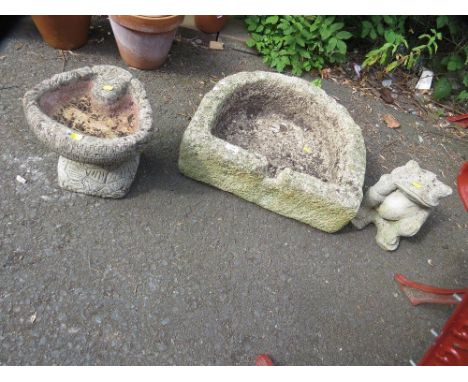 A sandstone trough together with a concrete frog and a bird bath 