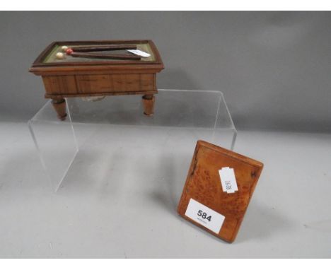 A novelty inkwell and stamp holder in the form of a billiard table together with a treen card case 